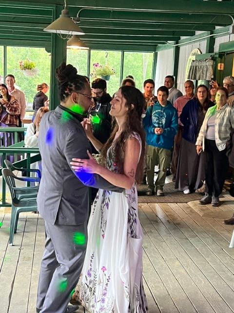 Couple sharing their first dance at a Maui wedding reception surrounded by guests
